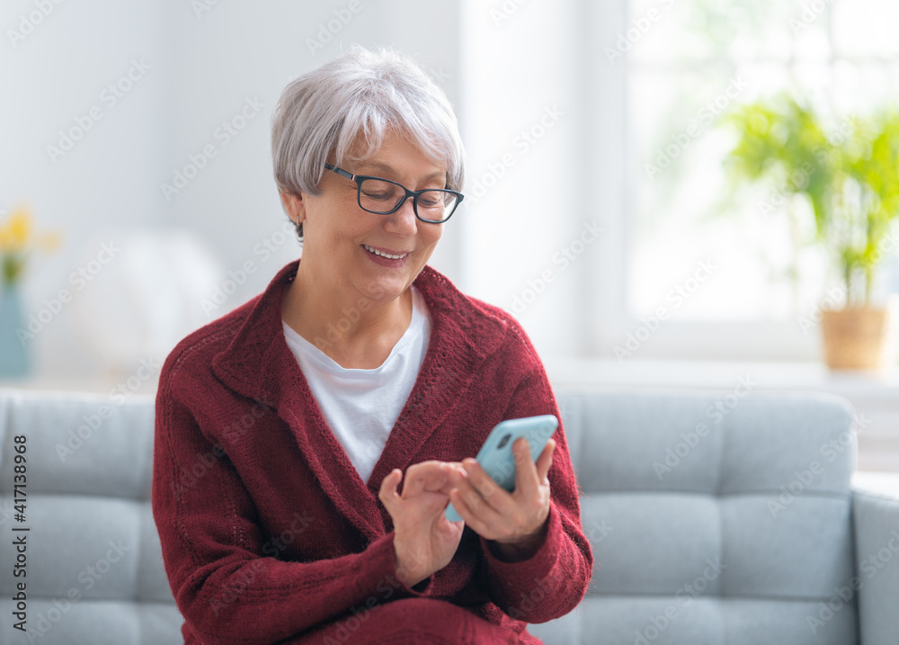 senior woman is using smartphone