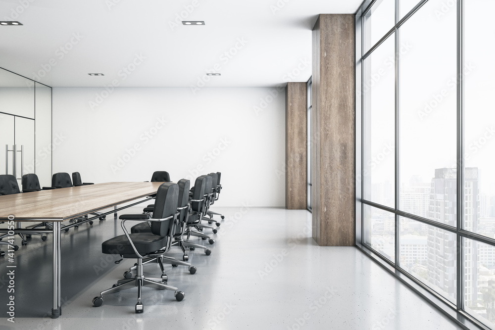 Light spacious meeting room with wooden conference table, black chairs around, glossy floor and big 