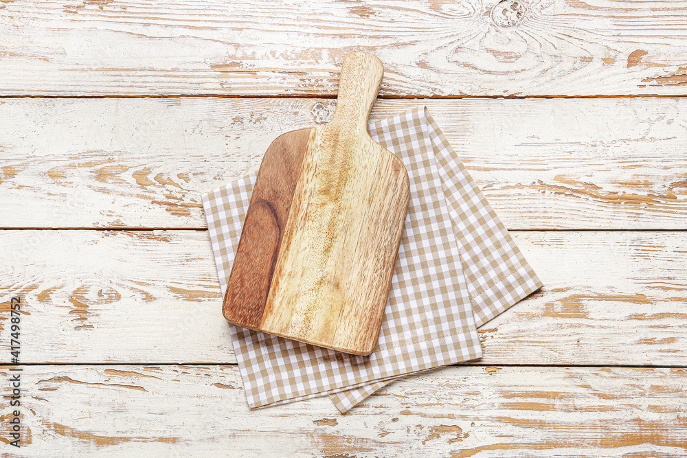 Cutting board on wooden background