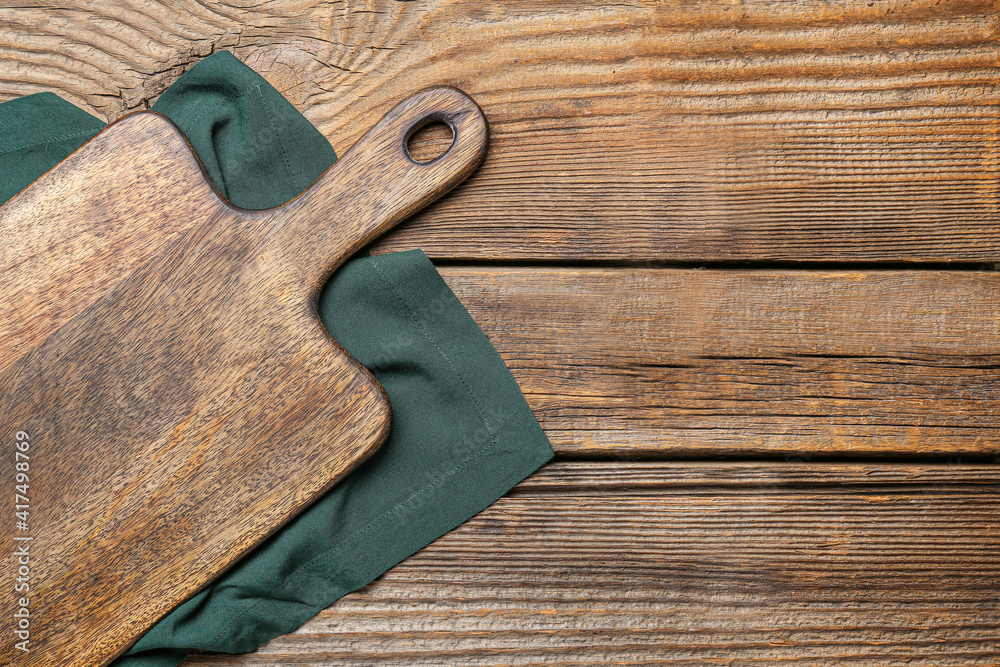 Cutting board on wooden background