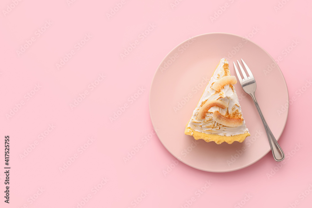 Plate with piece of tasty coconut pie on color background