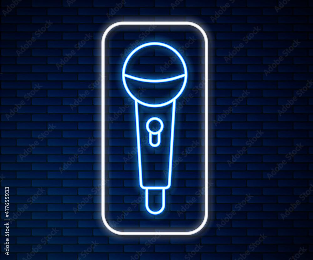 Glowing neon line Microphone icon isolated on brick wall background. On air radio mic microphone. Sp