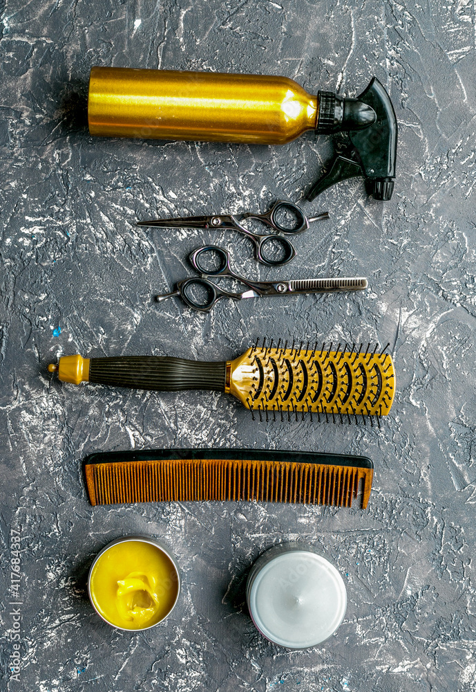 styling hair with tools in barbershop on gray background top view mock-up