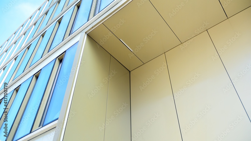 Fragment of glass and metal facade walls. Commercial office buildings. Abstract modern business arch