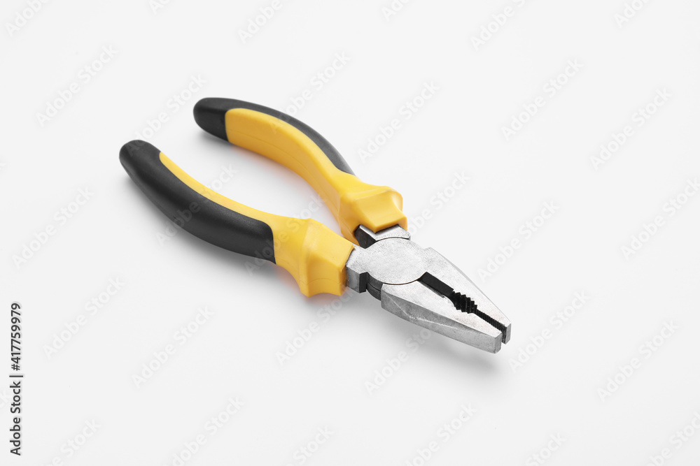 New pliers on white background