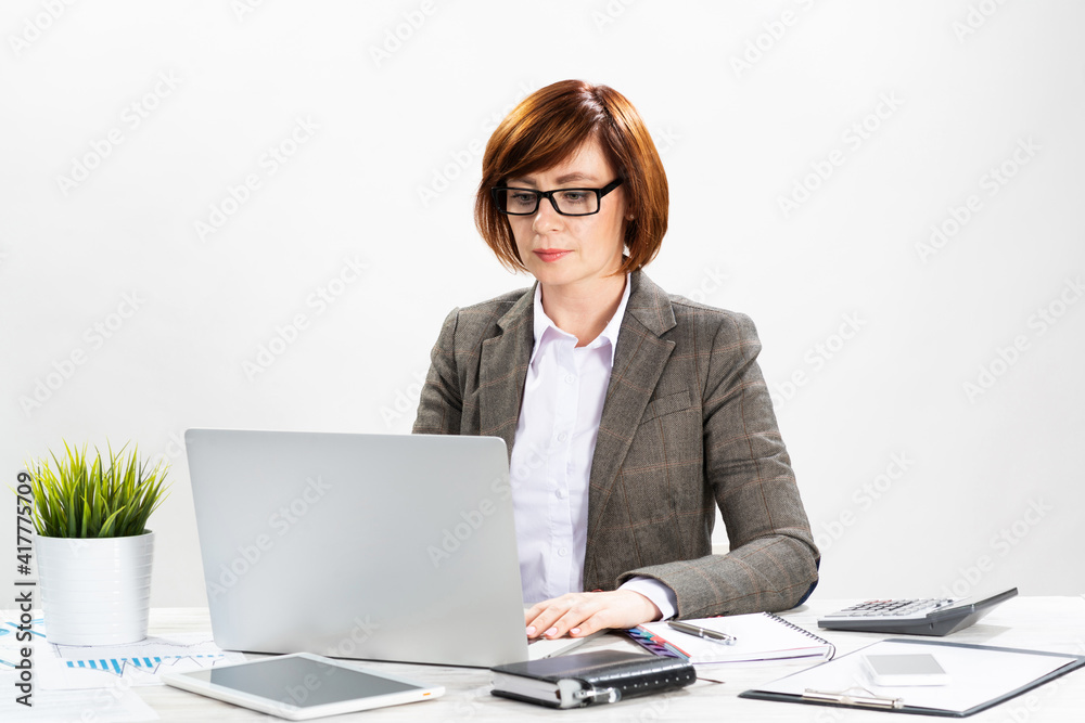 Attractive middle aged businesswoman working