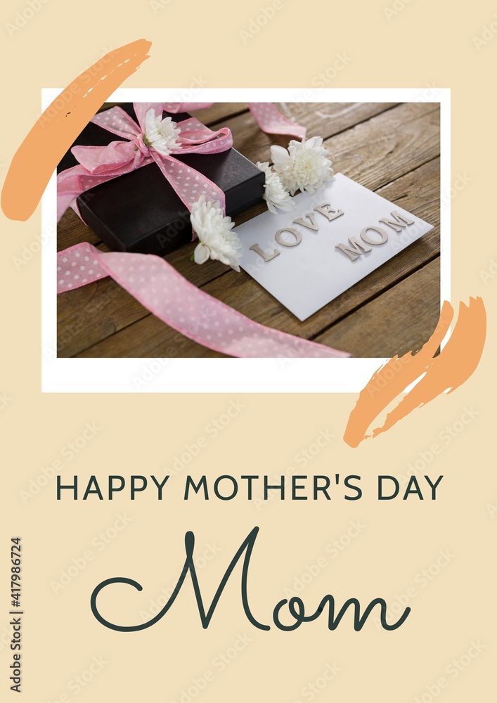 Happy mothers day text with present and love mom tag on wooden background