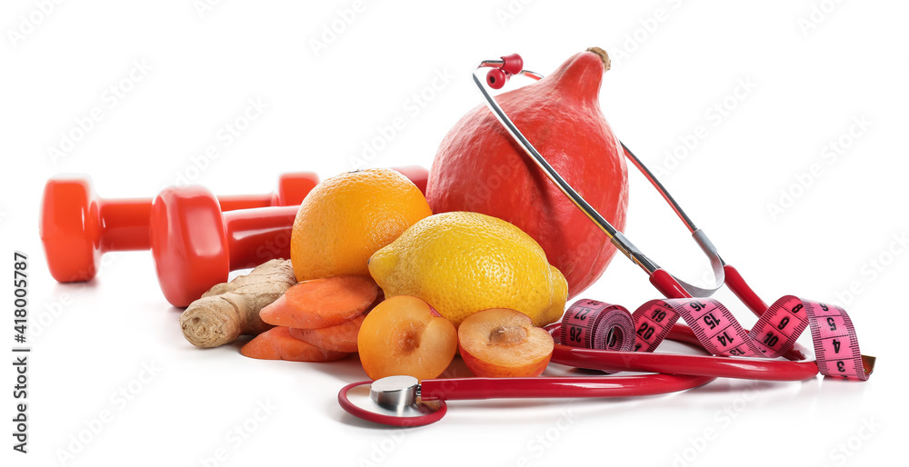 Healthy products, dumbbells and  stethoscope on white background