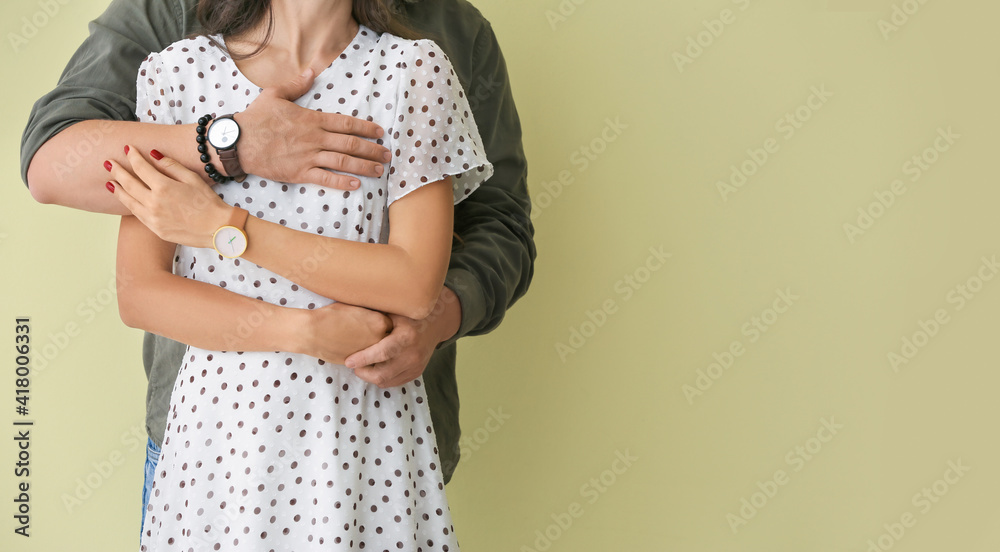 Young couple on color background