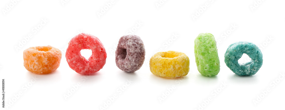 Tasty cereal rings on white background