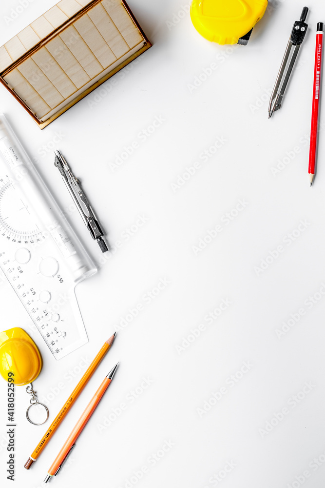 Construction office with architect tools on white background top view mockup