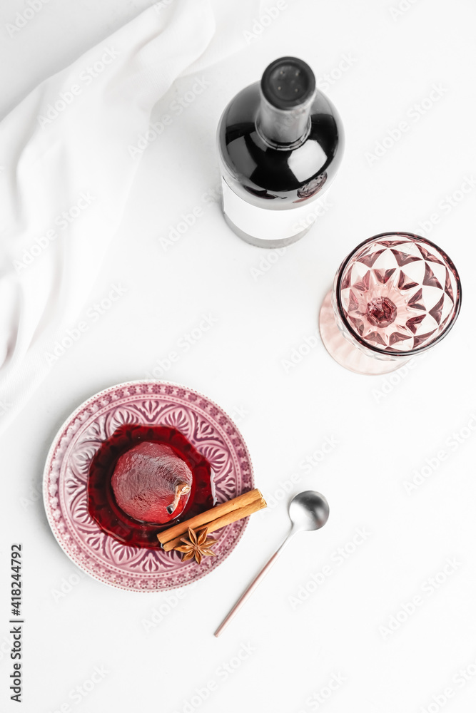 Composition with sweet poached pear on table