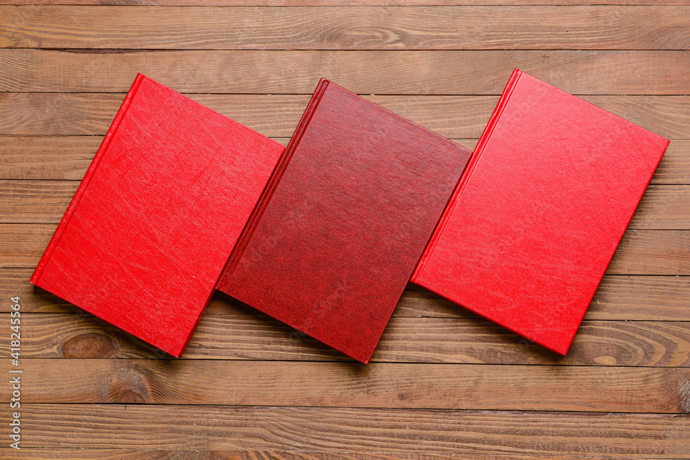 Blank books on wooden background