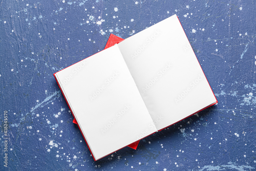 Blank open book on color background