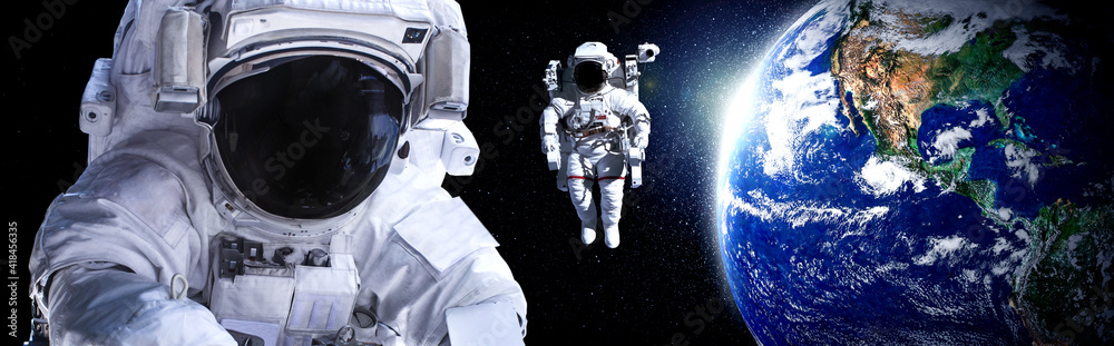 Astronaut spaceman do spacewalk while working for space station in outer space . Astronaut wear full