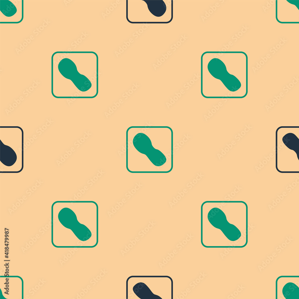 Green and black Human footprints shoes icon isolated seamless pattern on beige background. Shoes sol