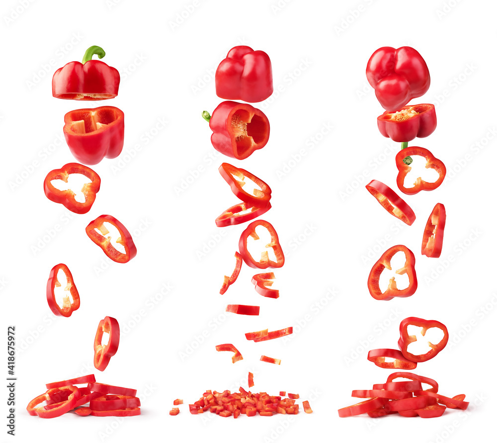 Sweet red pepper sliced and falling isolated on a white background