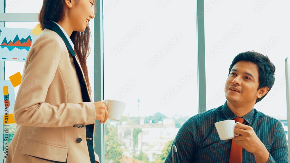 Two business people talk project strategy at office meeting room. Businessman discuss project planni