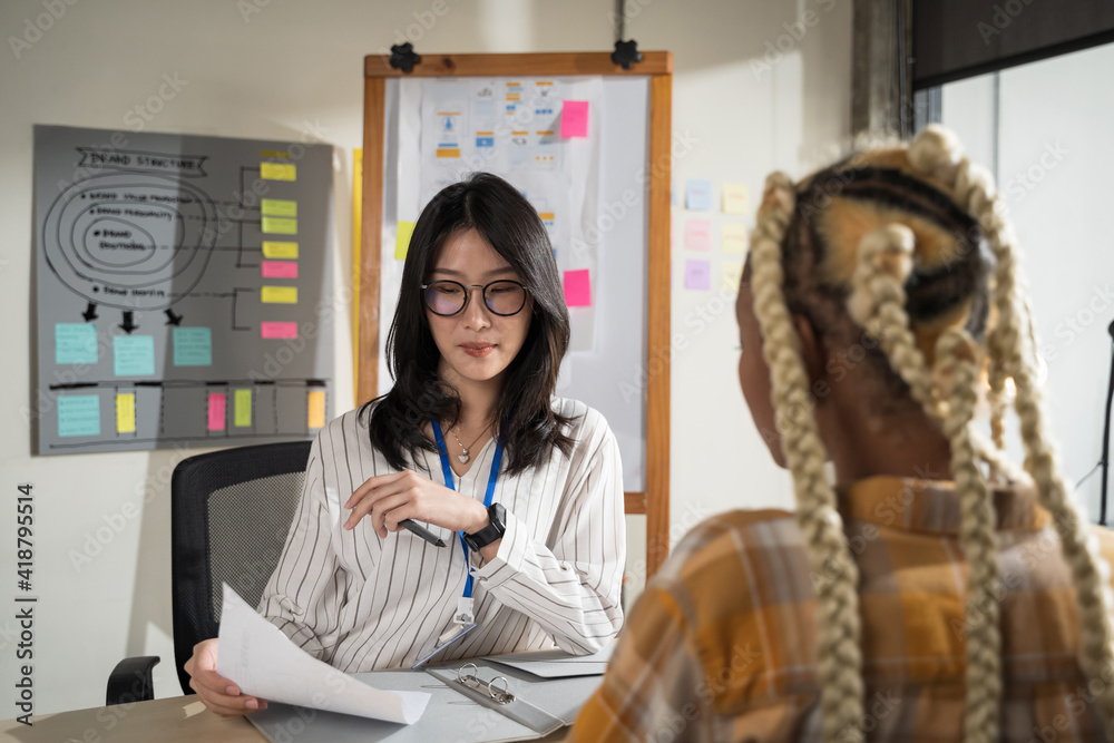 Asian women are doing serious job interviews.