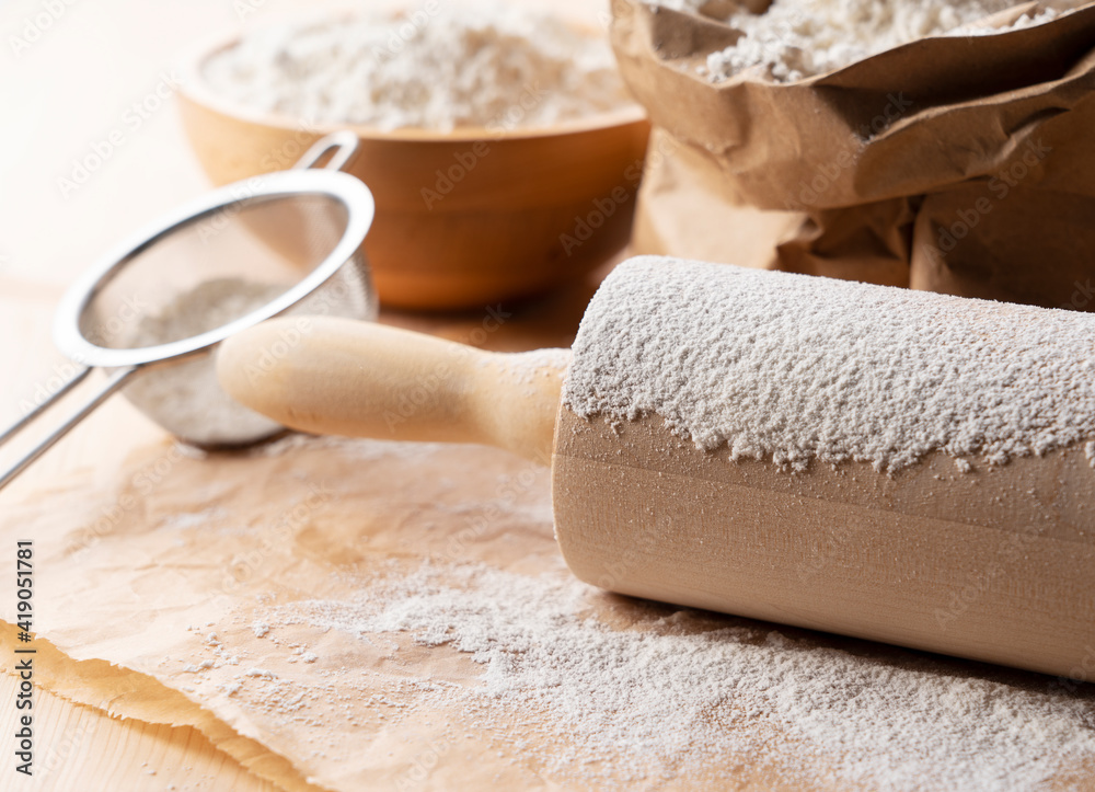 Flour and rolling pins on the table