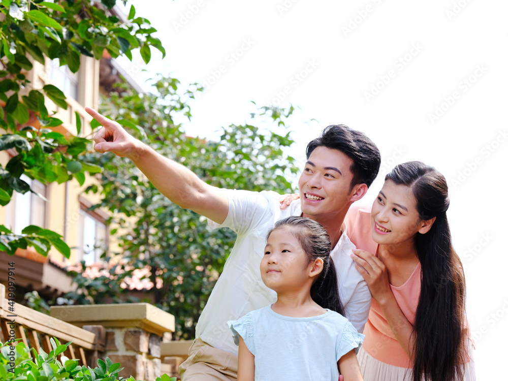 Happy family of three in the outdoor group photo