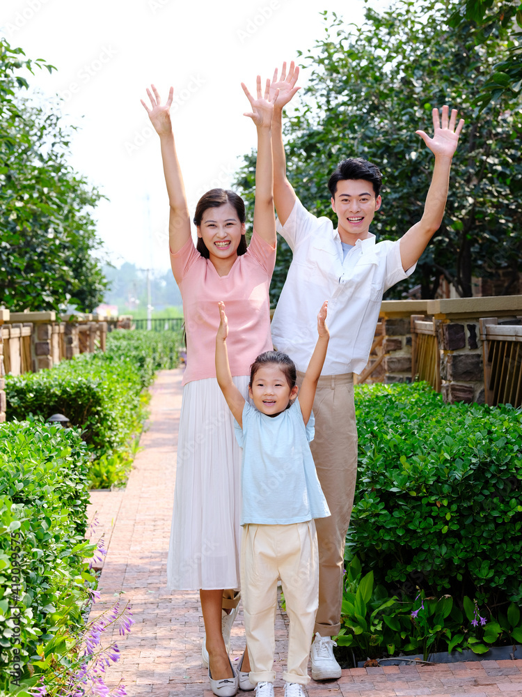 Happy family of three in the outdoor group photo