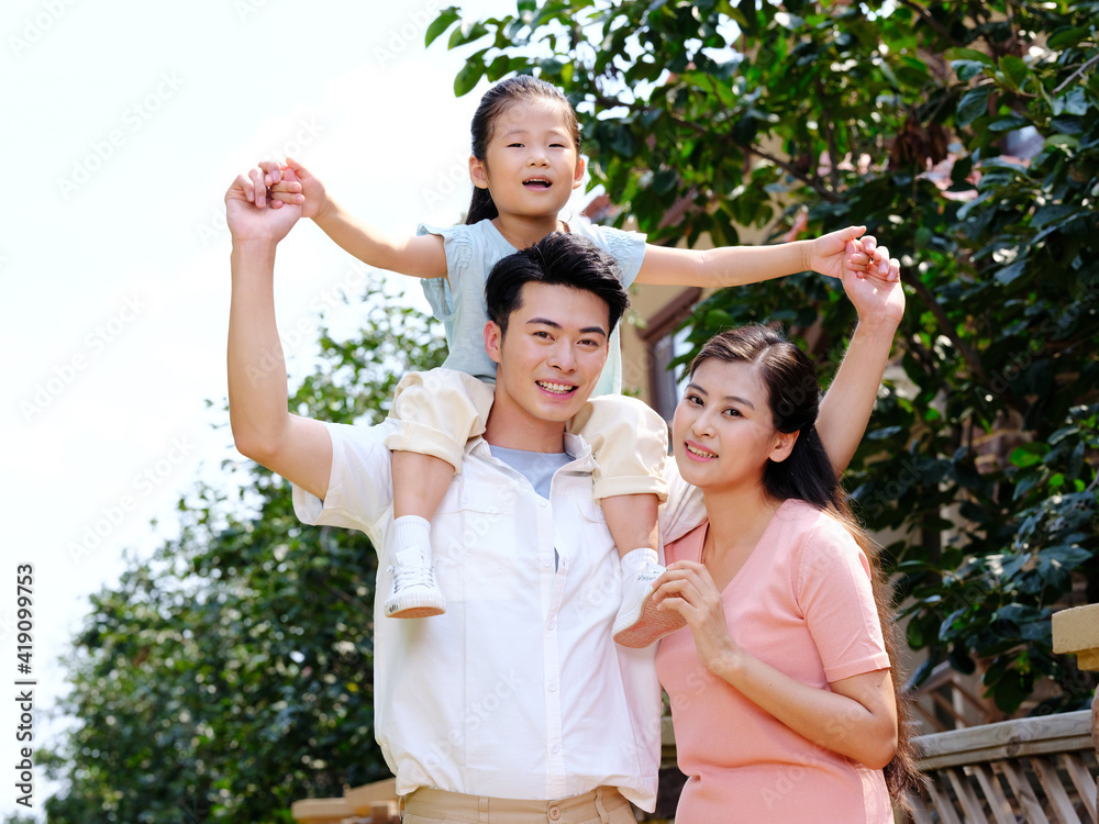 Happy family of three in the outdoor group photo