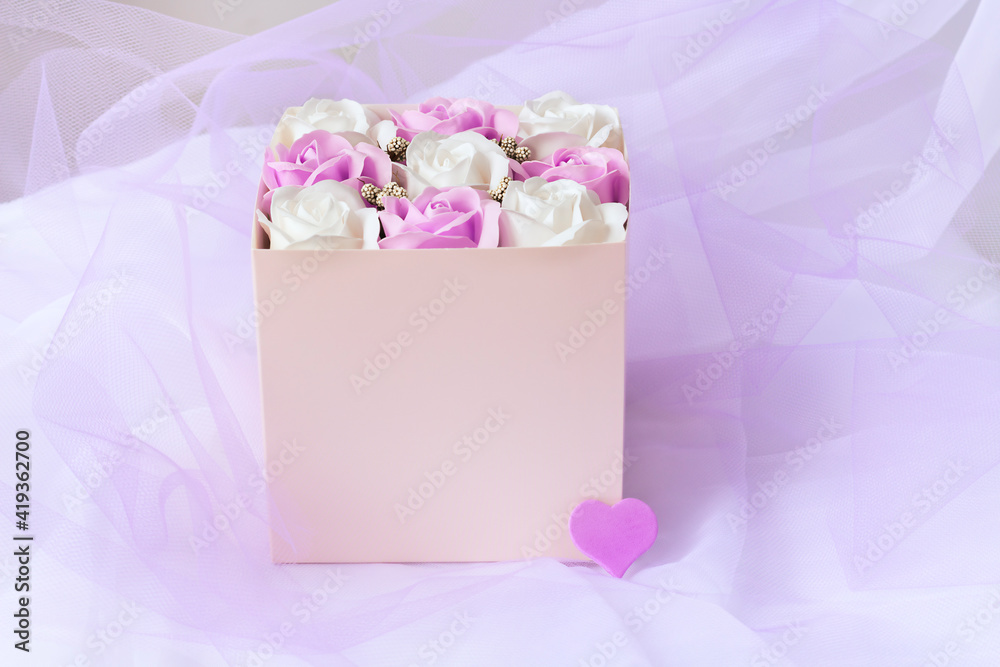 Bouquet roses in pink mock up box decorated by violet heart. Romantic gift for her.