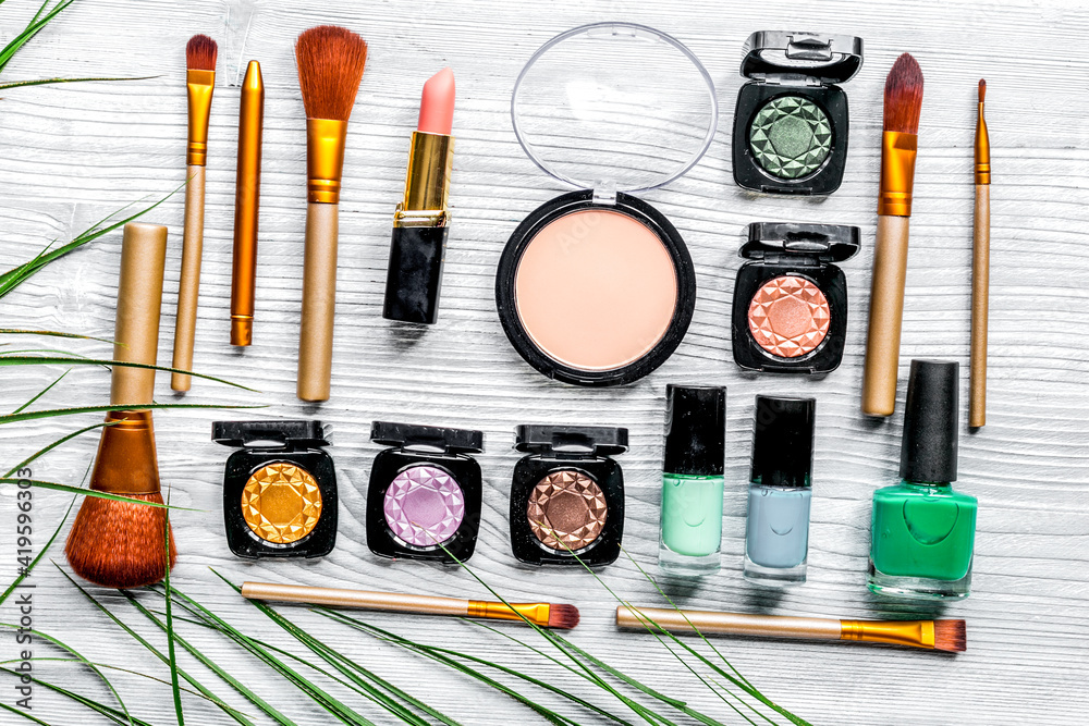 make up set with decorative cosmetics on woman table background top view