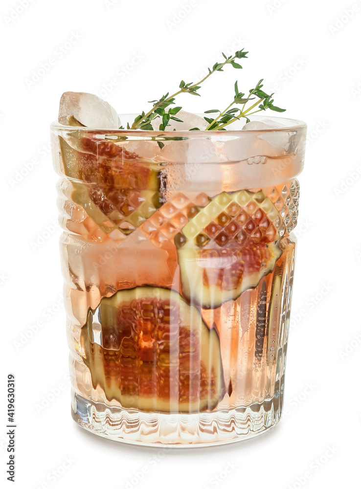 Glass of tasty fig lemonade on white background