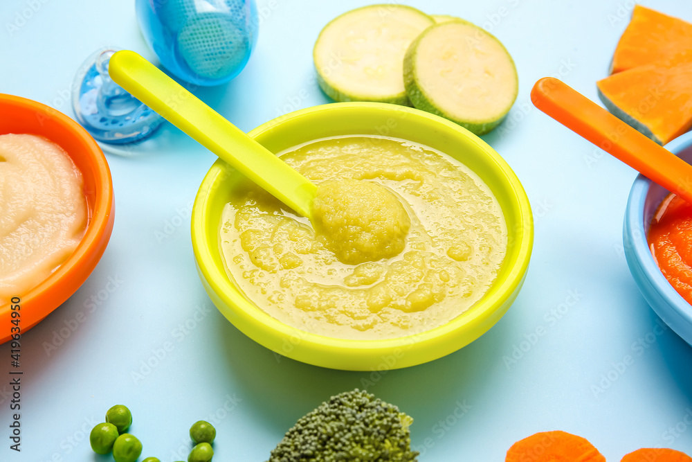 Composition with healthy baby food on color background, closeup