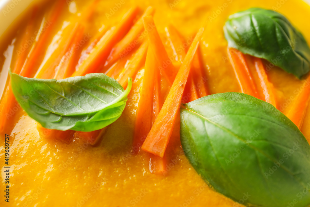 Tasty carrot cream soup, closeup