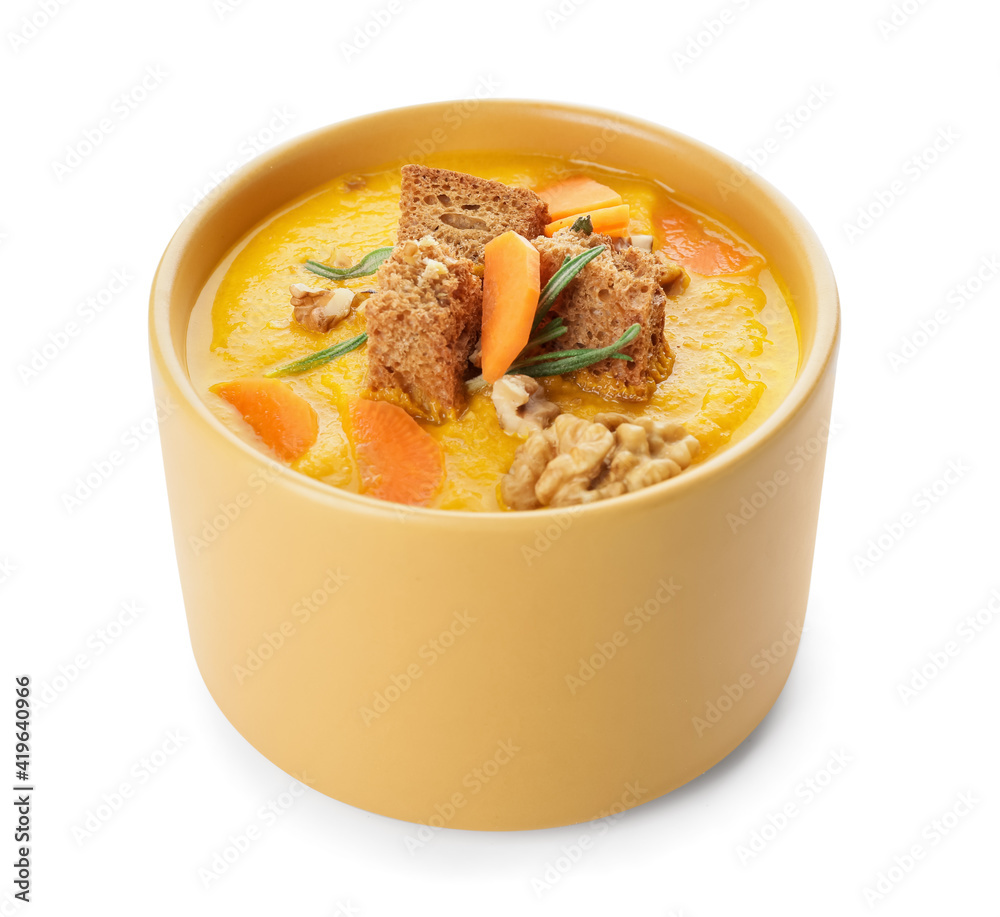 Cooking pot of tasty carrot cream soup on white background