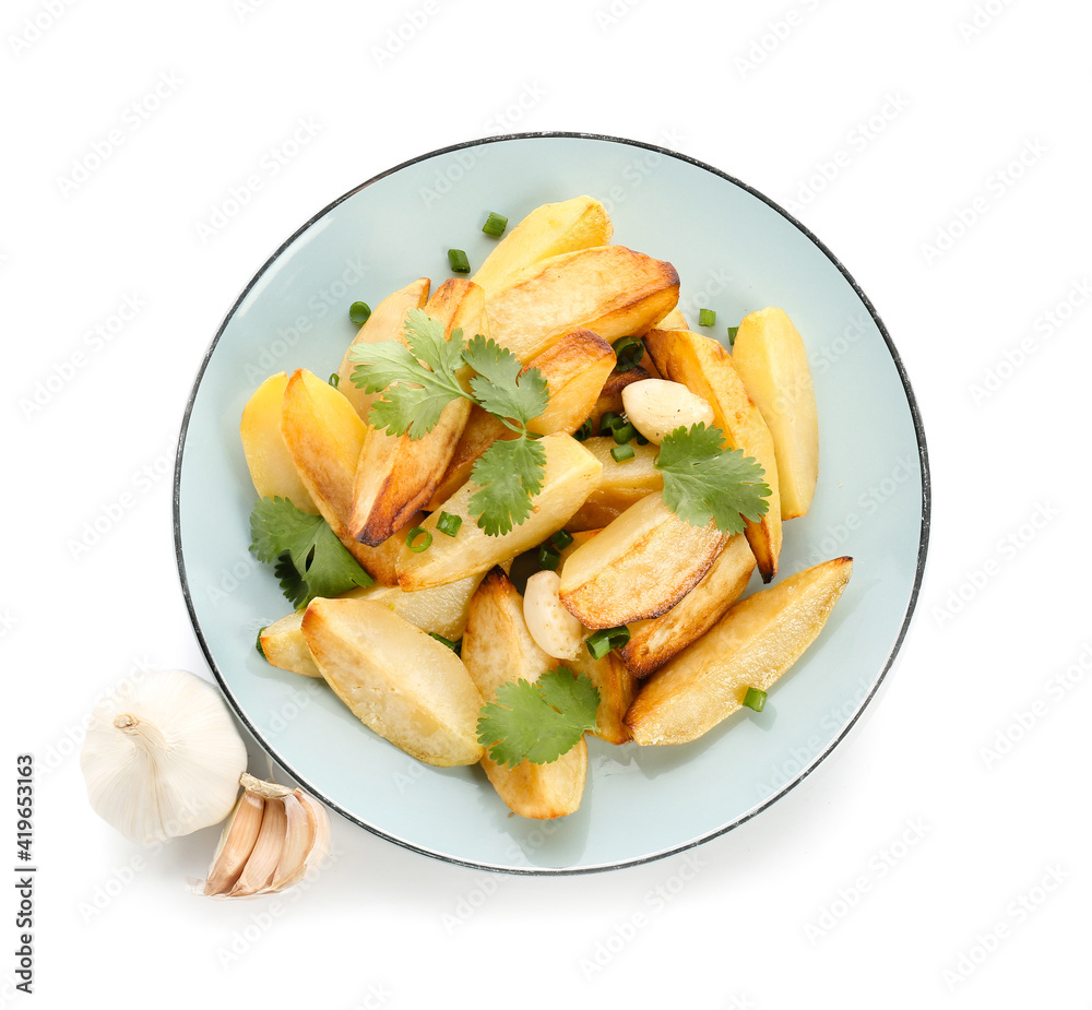 Plate of tasty baked potato with garlic on white background