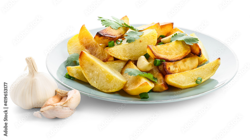 Plate of tasty baked potato with garlic on white background