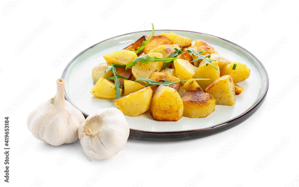 Plate of tasty baked potato with garlic on white background