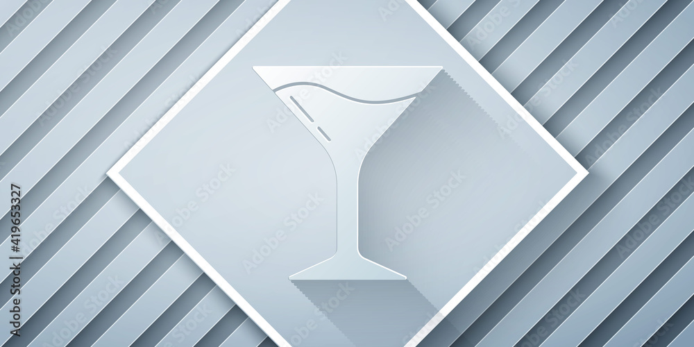 Paper cut Martini glass icon isolated on grey background. Cocktail icon. Wine glass icon. Paper art 