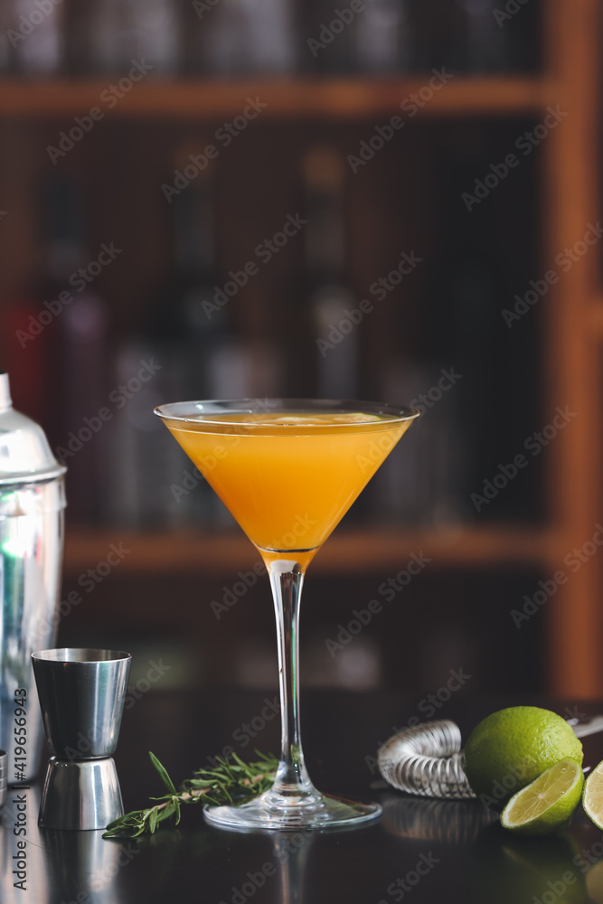 Glass of tasty mango margarita on table in bar