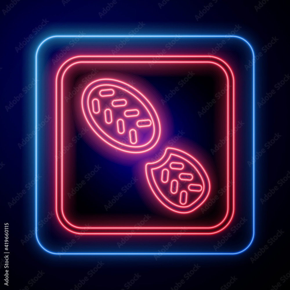 Glowing neon Human footprints shoes icon isolated on black background. Shoes sole. Vector.