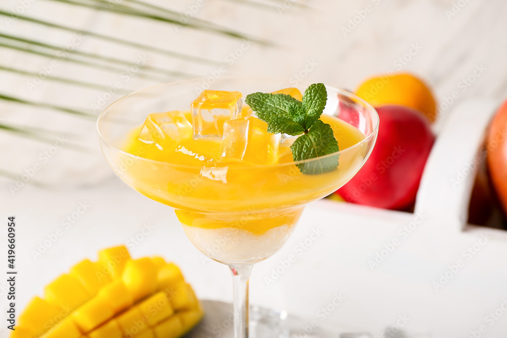 Glass of margarita with mango, closeup