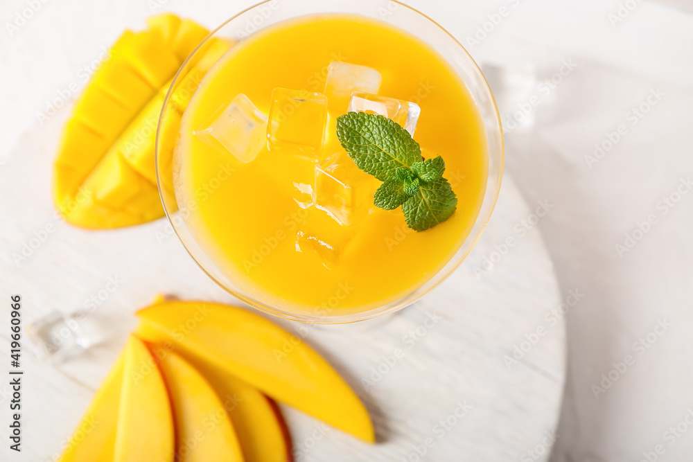 Glass of margarita with mango, closeup