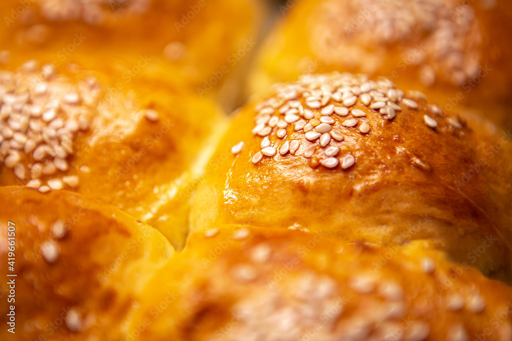 Close up shot homemade food baking concept. Fresh hot soft fluffy ginger golden brown sesame seeds b