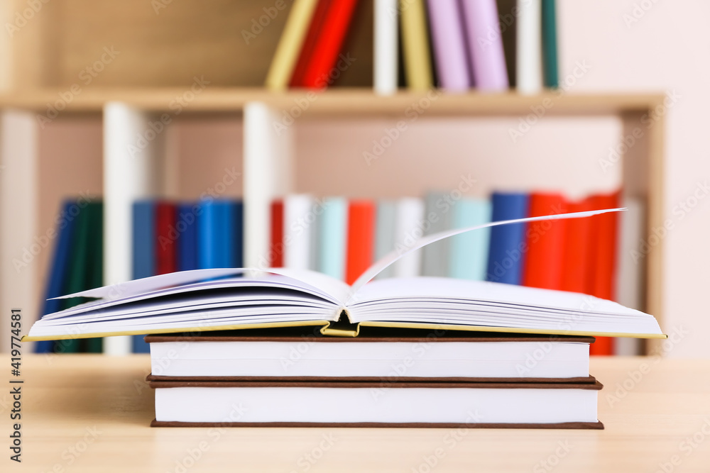 Stack of books on table in room