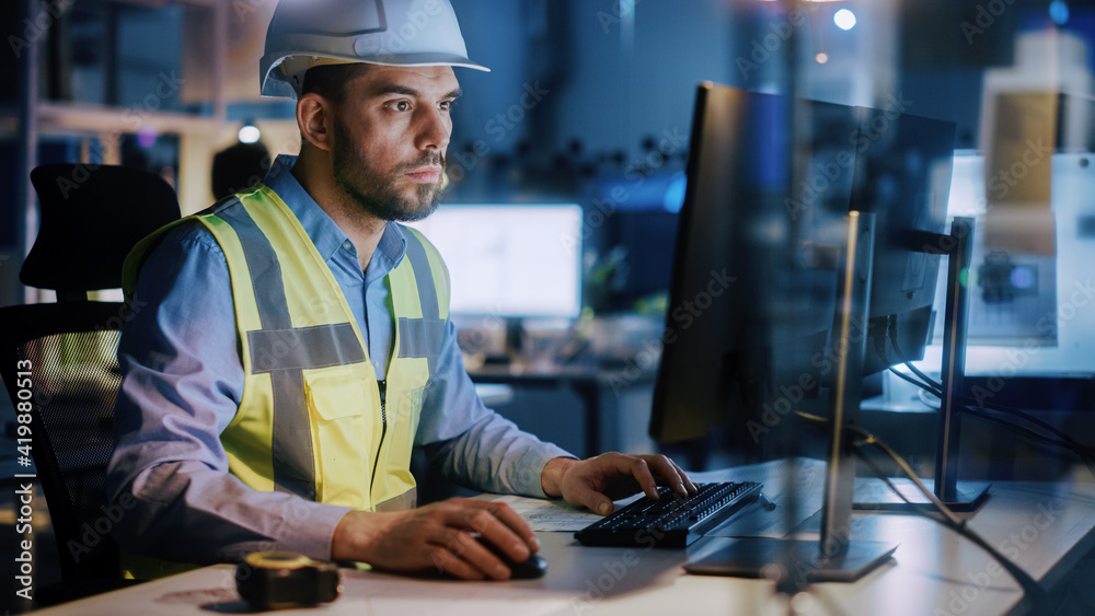 Electronics Design Factory: Portrait of Handsome Male Engineer Wearing Safety Vest Working on Comput