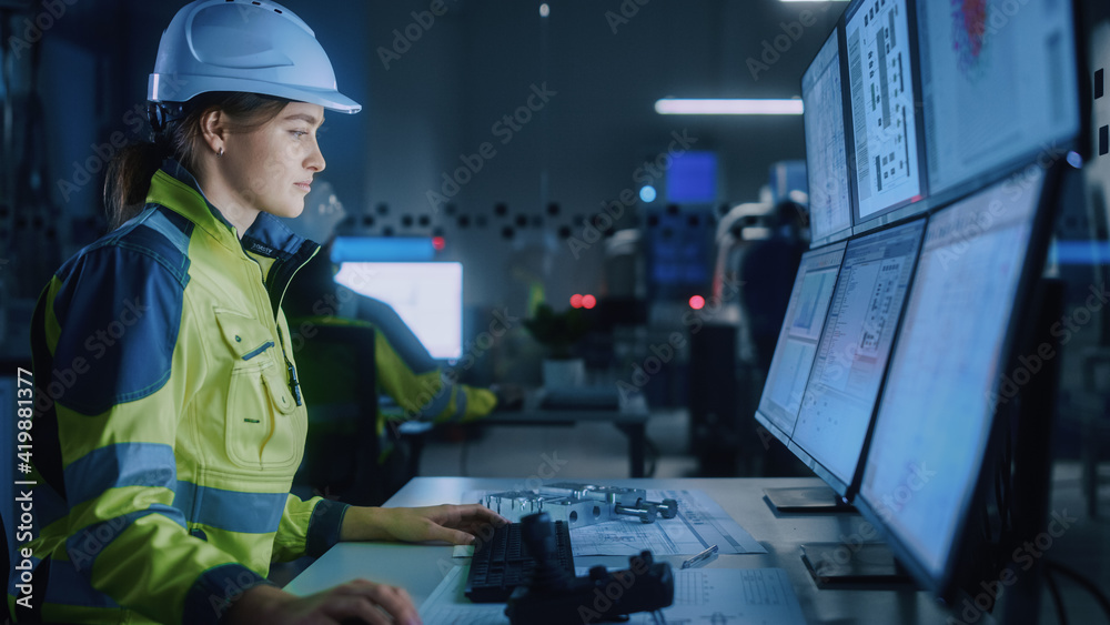 Industry 4.0 Modern Factory: Female Facility Operator Controls Workshop Production Line, Uses Comput