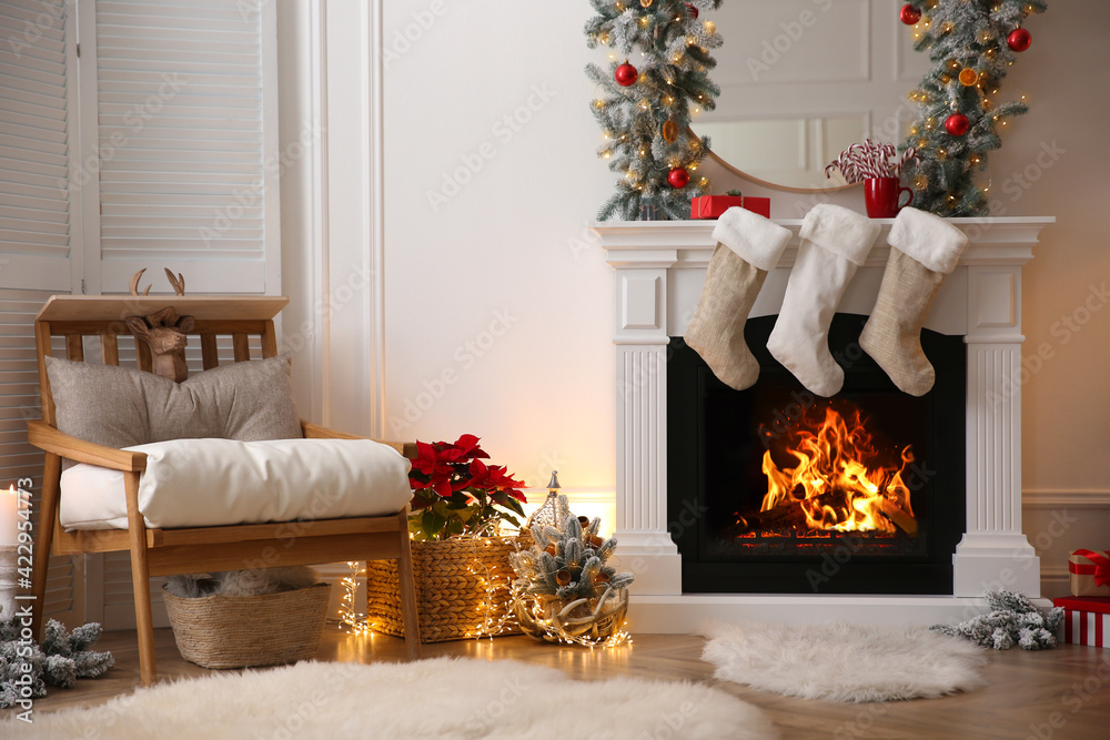 Fireplace with Christmas stockings in beautifully decorated living room