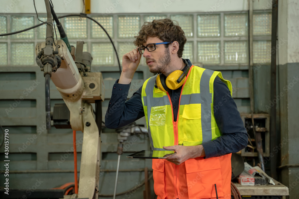 Industrial engineer working in a industrial manufacturing factory.