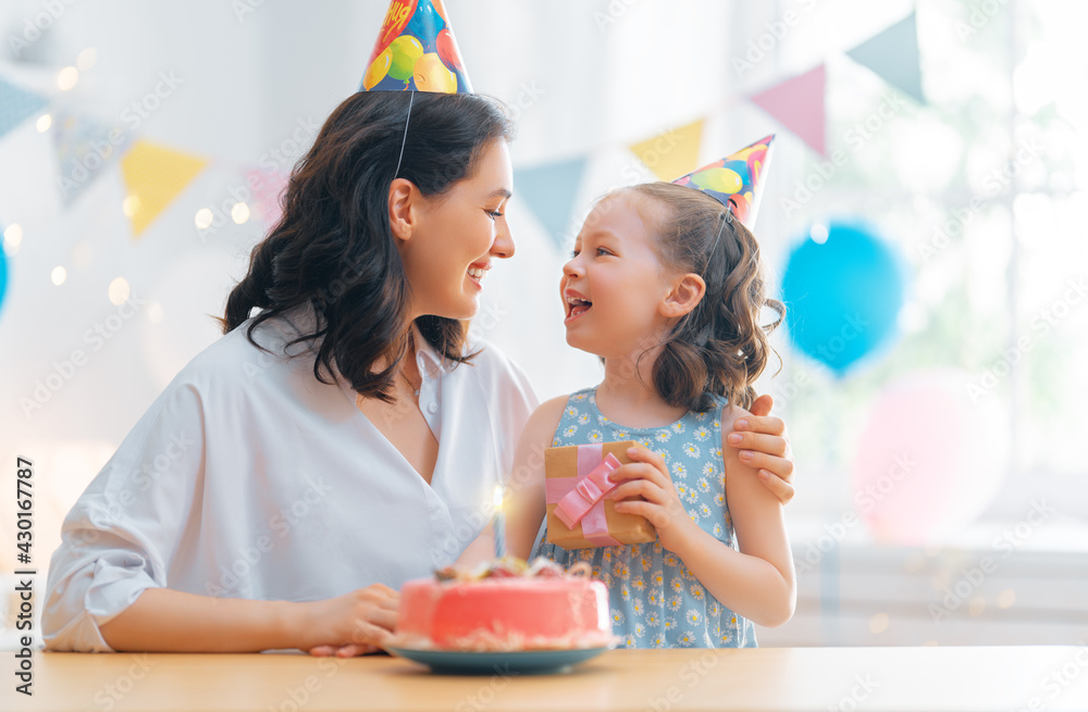 Mother and daughter are celebrating birthday.