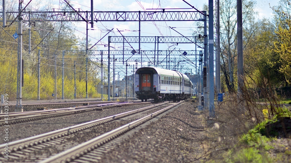 Passenger train of public transport on railroad track.