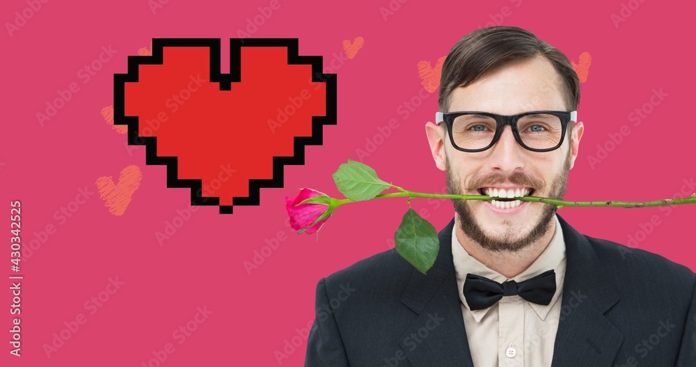 Composition of smiling man with rose in his mouth and red digital heart on pink background